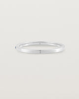A fine white  gold wedding ring with thirteen blue sapphires