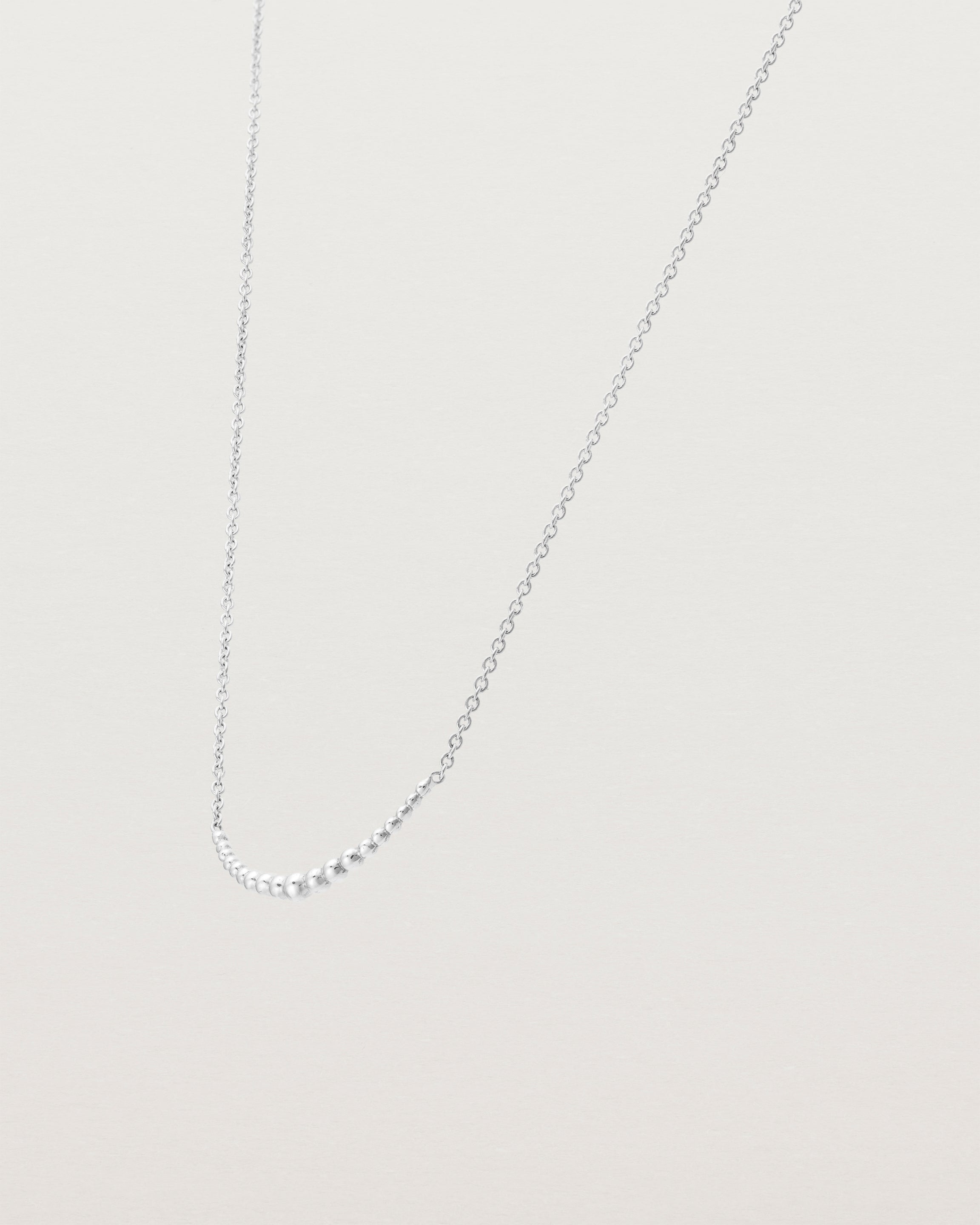 Angled view of the Crescent Necklace in Sterling Silver.
