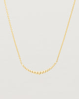 Close up of the Crescent Necklace in yellow gold.