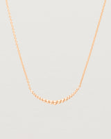 Close up view of the Crescent Necklace in Rose Gold. 