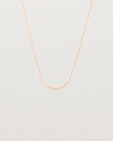 Front view of the Crescent Necklace in Rose Gold.