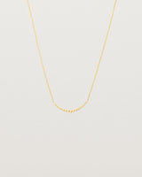 Front view of the Crescent Necklace in yellow gold.