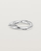 A silver ring featuring two entwined metal bands