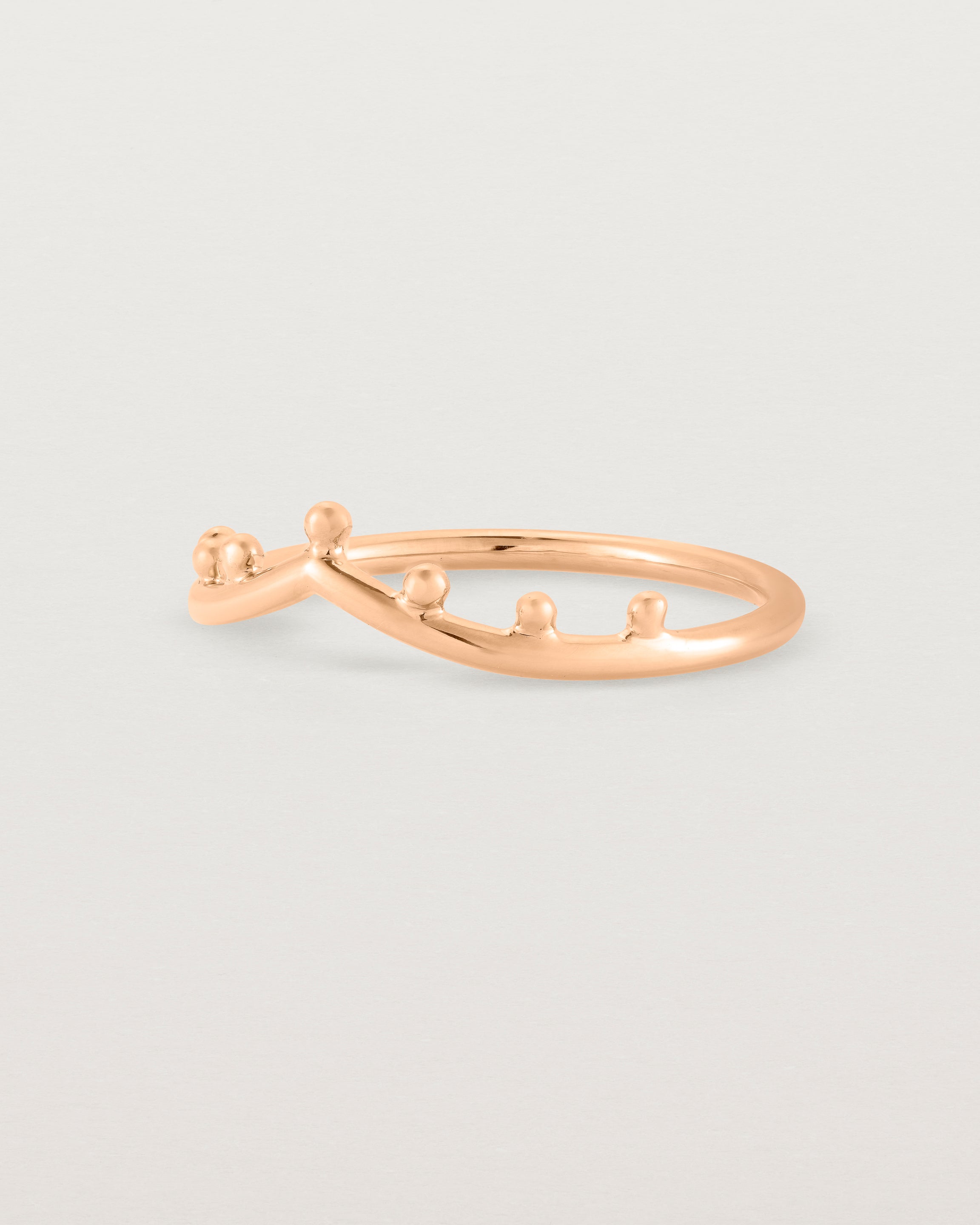 Angled view of the Dotted Gentle Point Ring in Rose Gold.