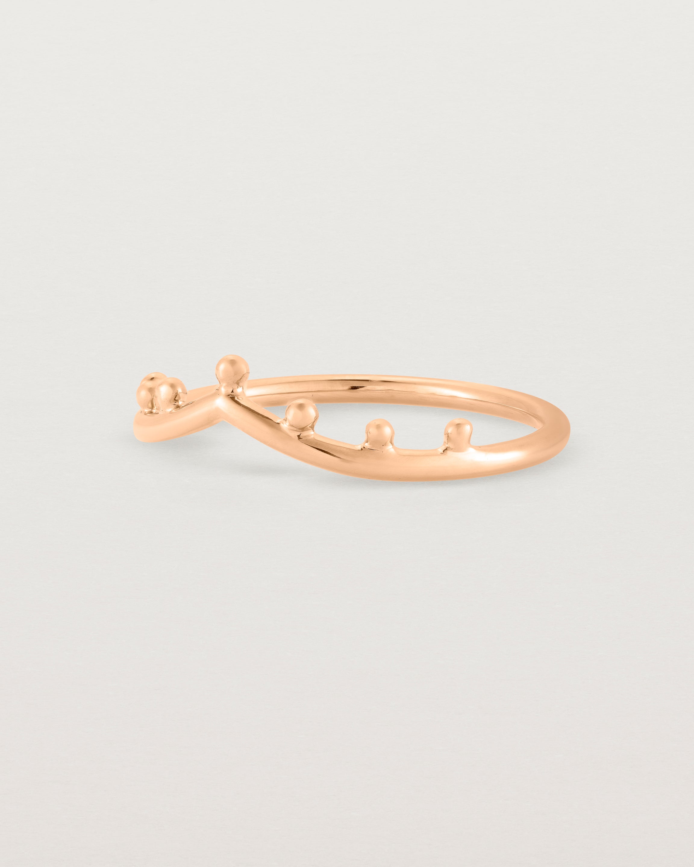 Angled view of the Dotted Gentle Point Ring in Rose Gold.