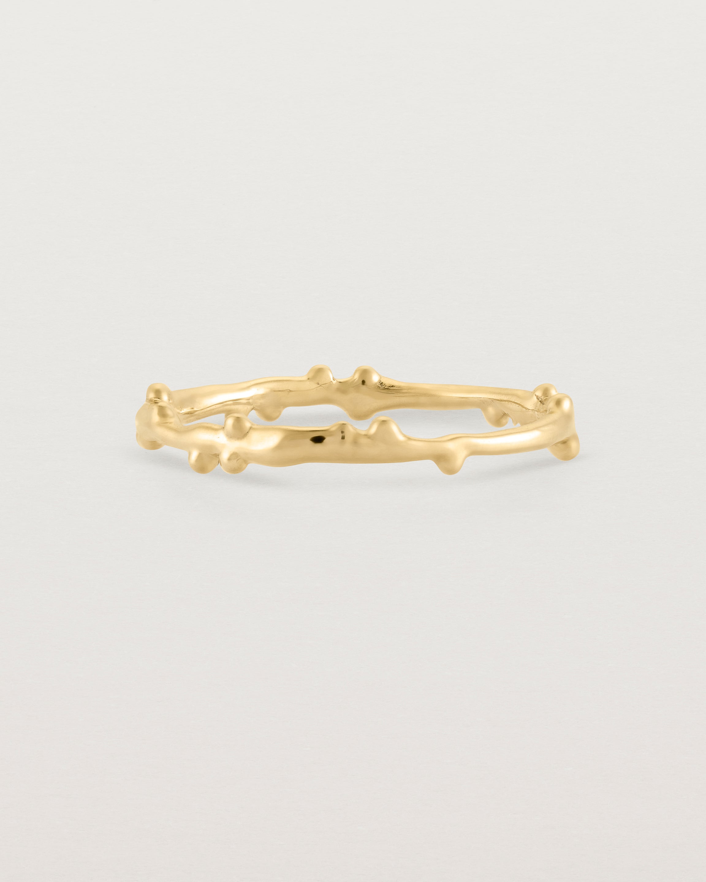 The Dotted Organic Stacking Ring in Yellow Gold.