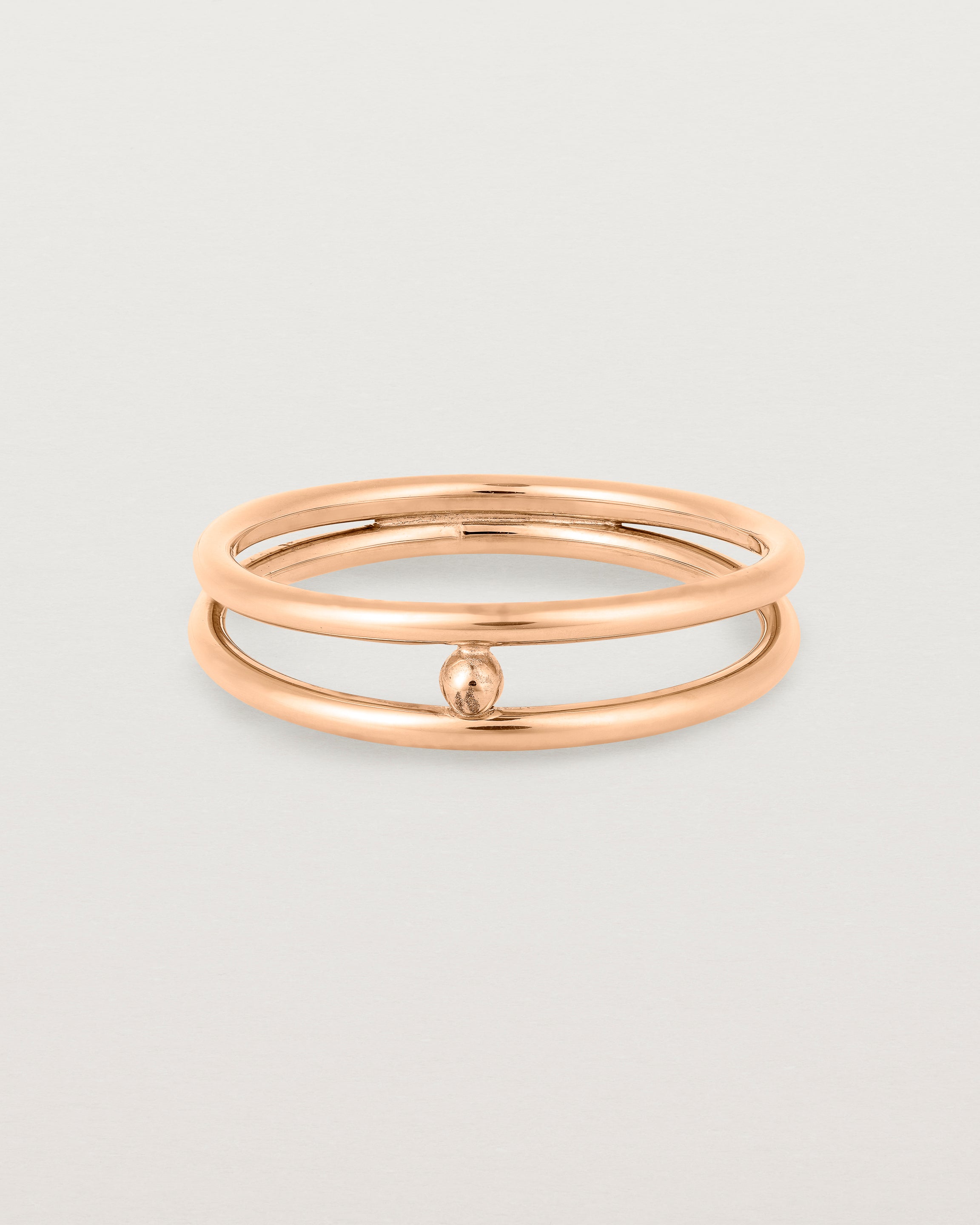 Front view of the Double Reliquum Ring in Rose Gold.