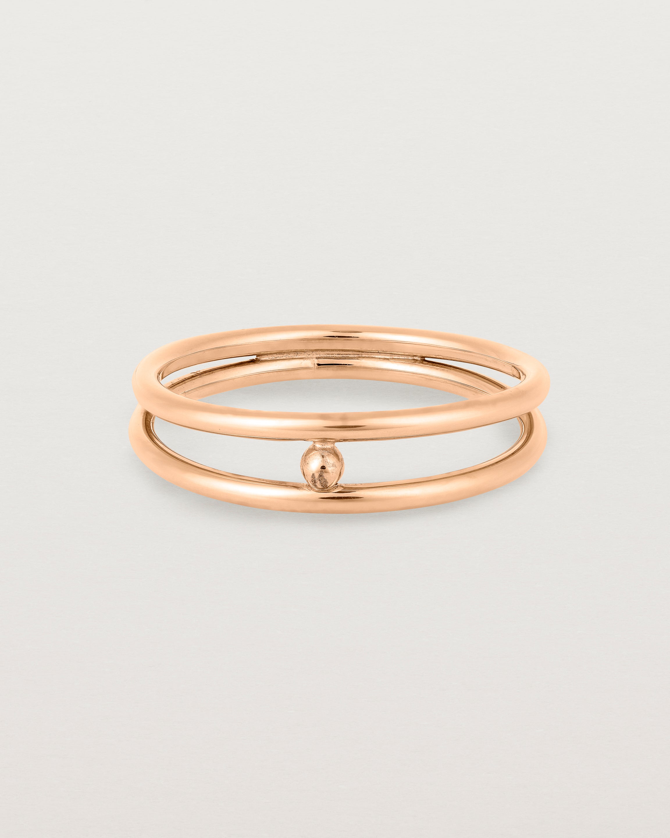 Front view of the Double Reliquum Ring in Rose Gold.