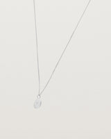 Angled view of the Eily Necklace with a diamond in white gold.