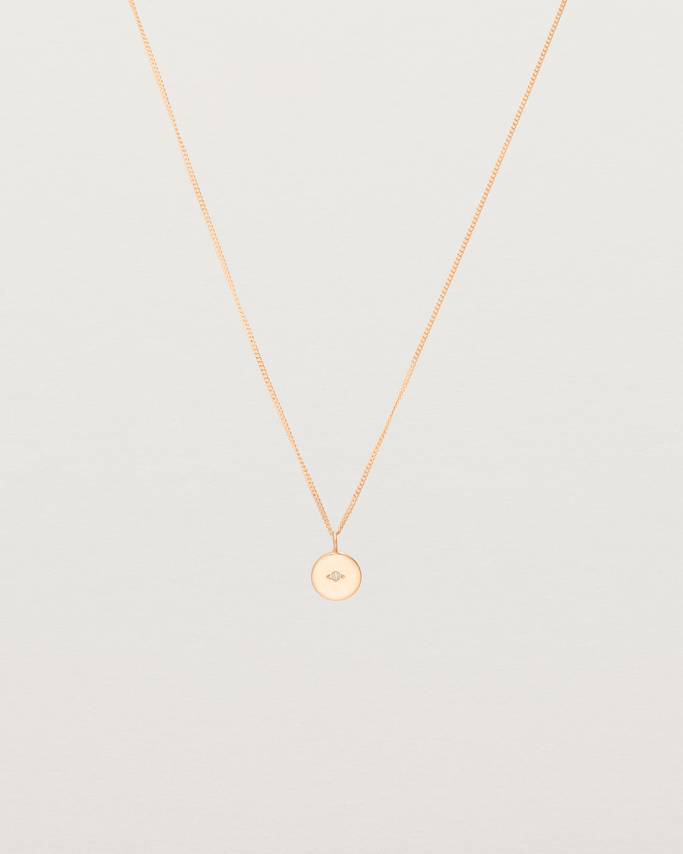 Front view of the Eily Necklace with a diamond in rose gold.