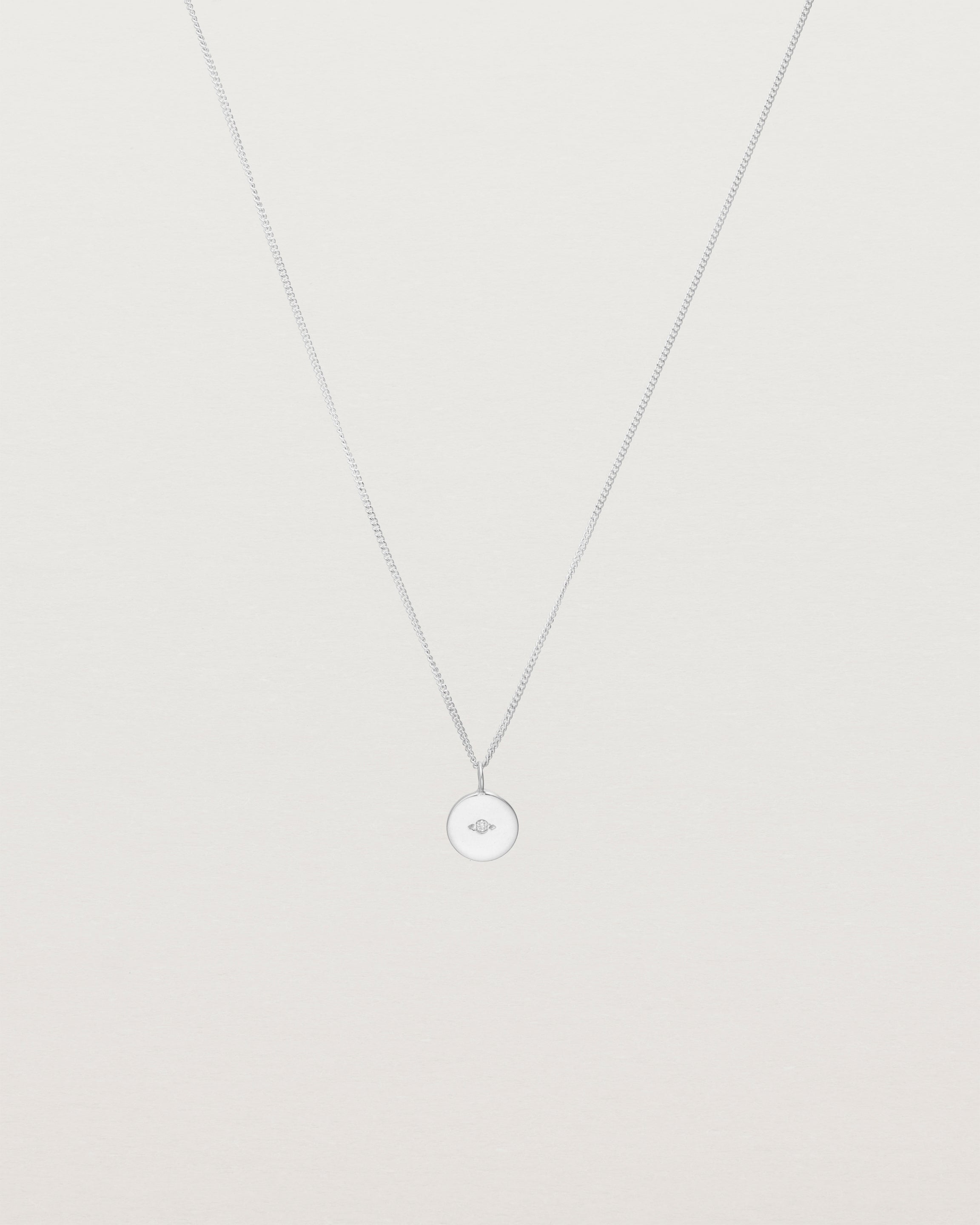 Front view of the Eily Necklace with a diamond in white gold.
