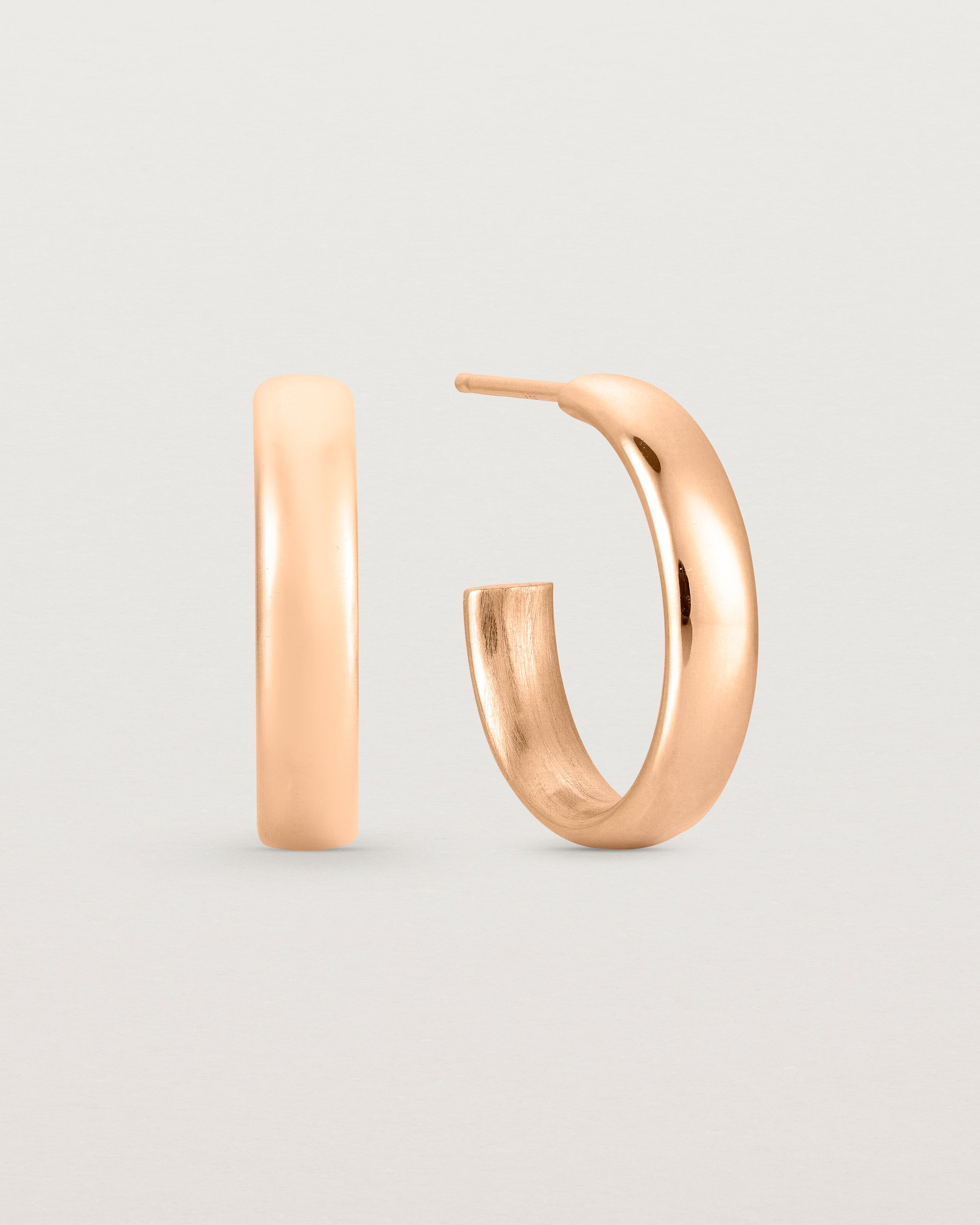 Side view of the Ellipse Hoops | Rose Gold.
