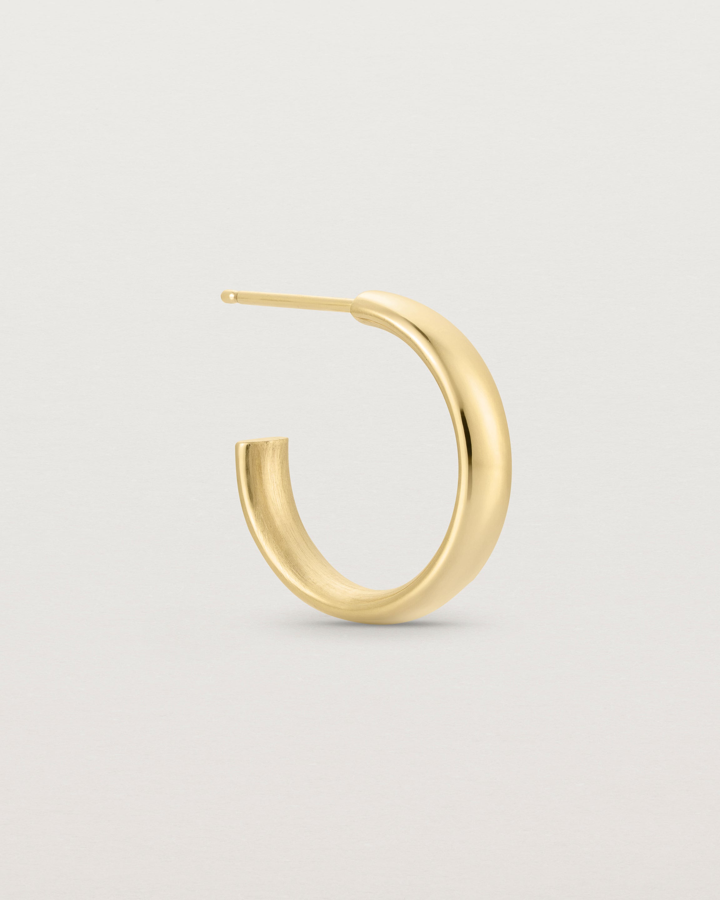 Side view of the Ellipse Hoops | Yellow Gold.