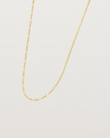 Angled view of the the Figaro Chain Necklace | Bold in Yellow Gold.