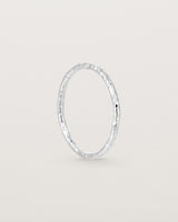 Standing view of the Faceted Wedding Ring in White Gold.