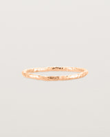 Front view of the Faceted Wedding Ring in Rose Gold.