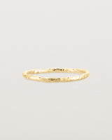 Front view of the Faceted Wedding Ring in Yellow Gold.
