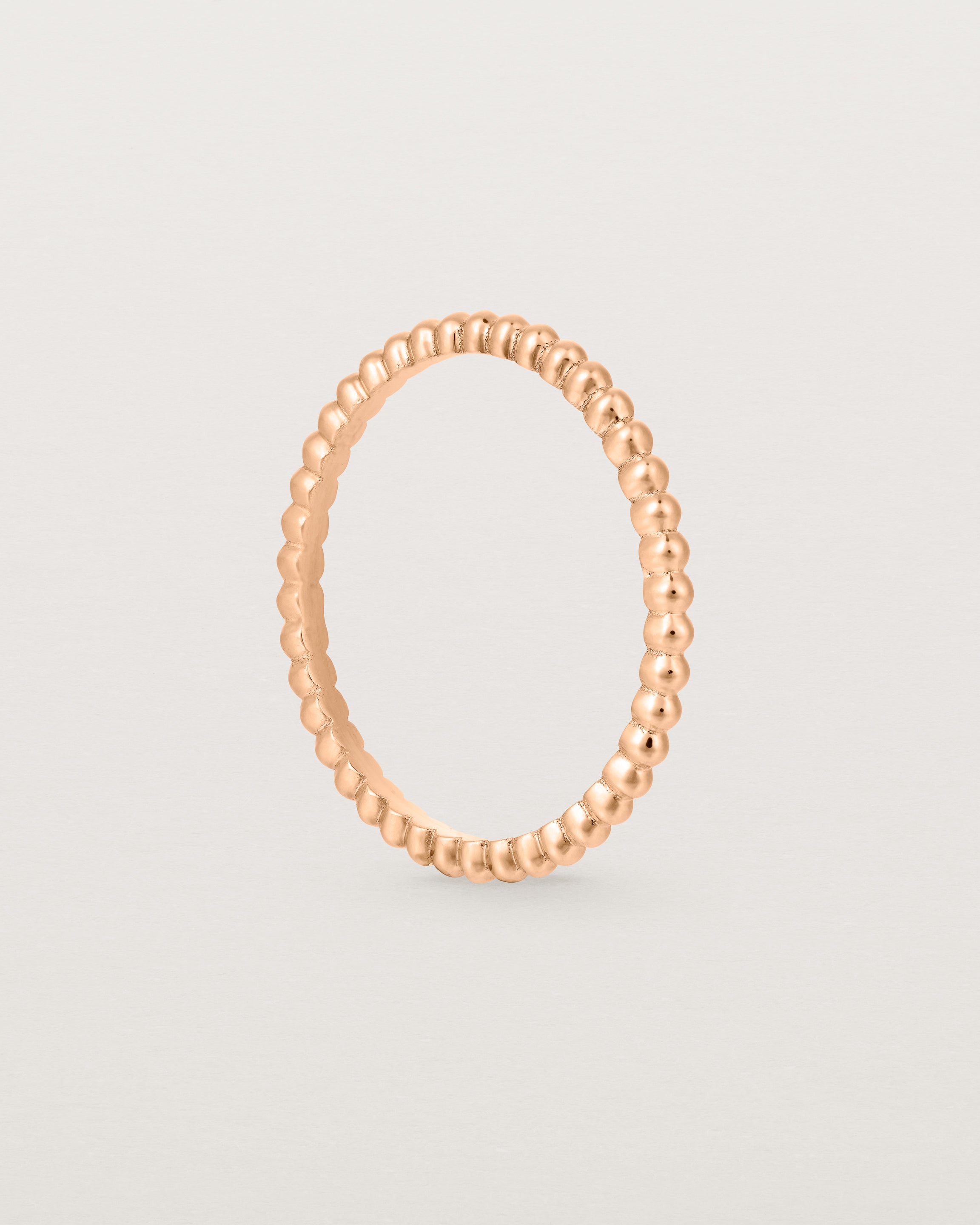 Standing view of the Dotted Stacking Ring in Rose Gold.