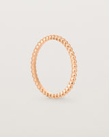 Standing view of the Dotted Stacking Ring in Rose Gold.