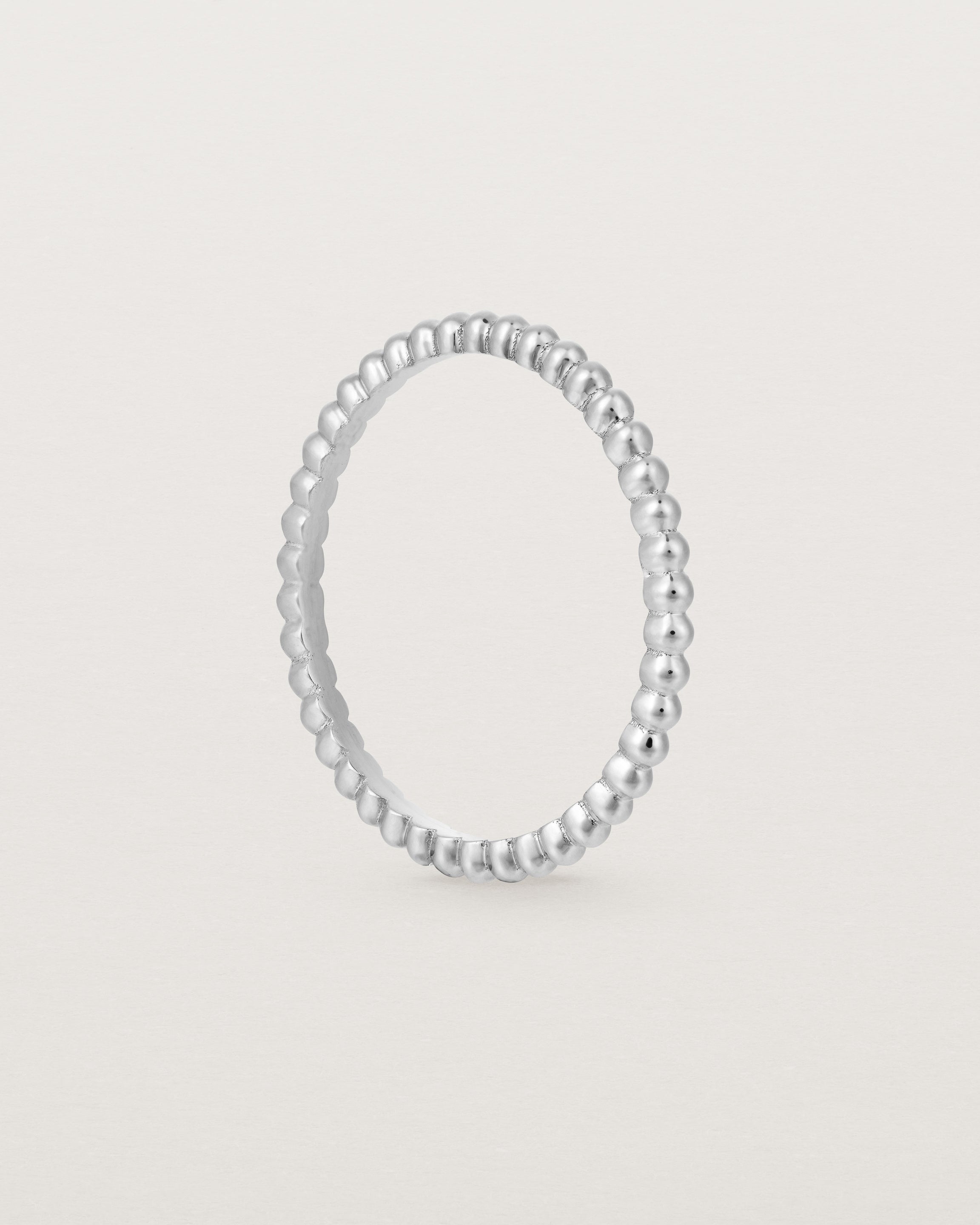 Standing view of the Dotted Stacking Ring in Sterling Silver.