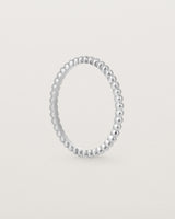 Standing view of the Dotted Stacking Ring in Sterling Silver.