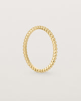 Standing view of the Dotted Stacking Ring in Yellow Gold.