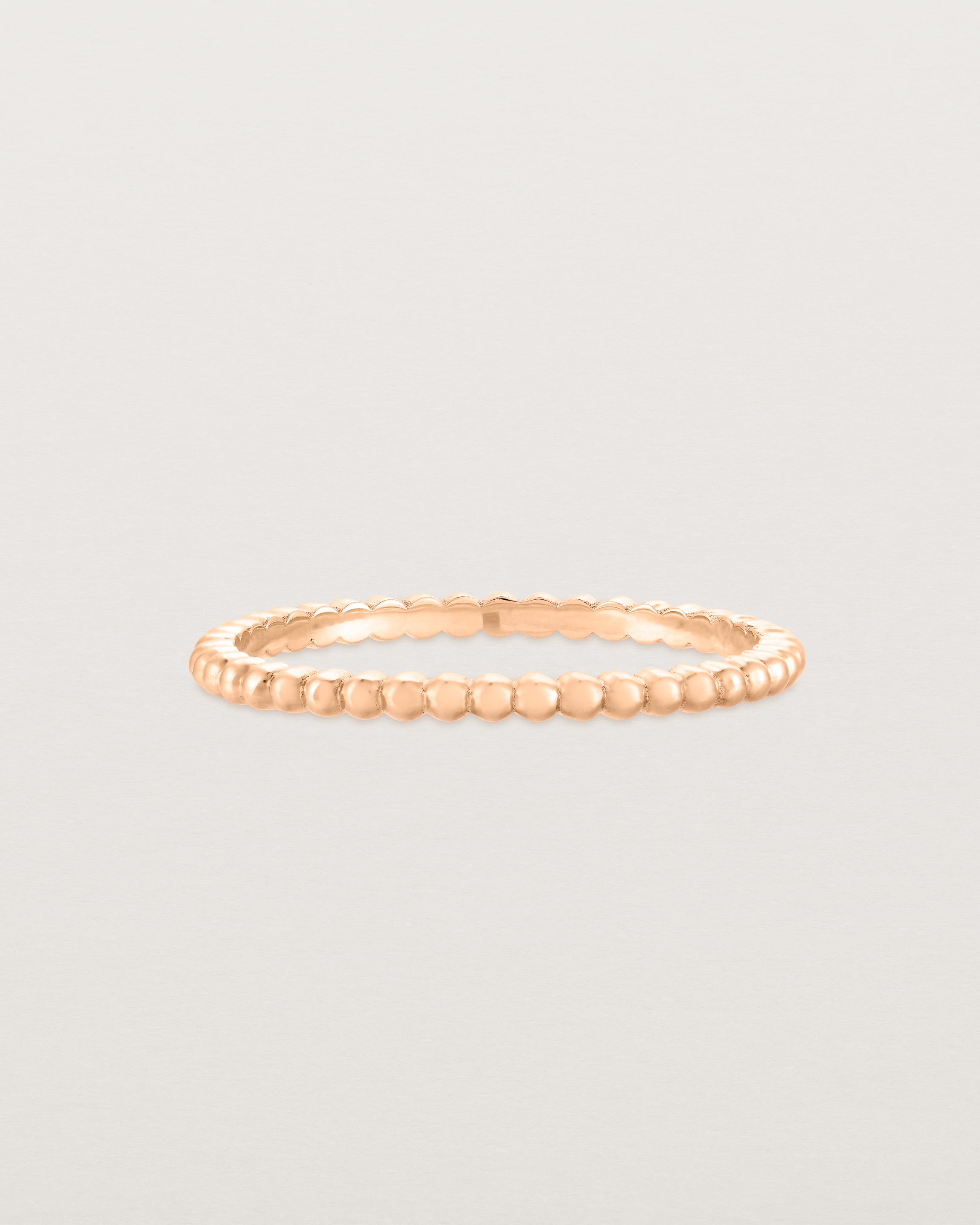 Front view of the Dotted Stacking Ring in Rose Gold. 