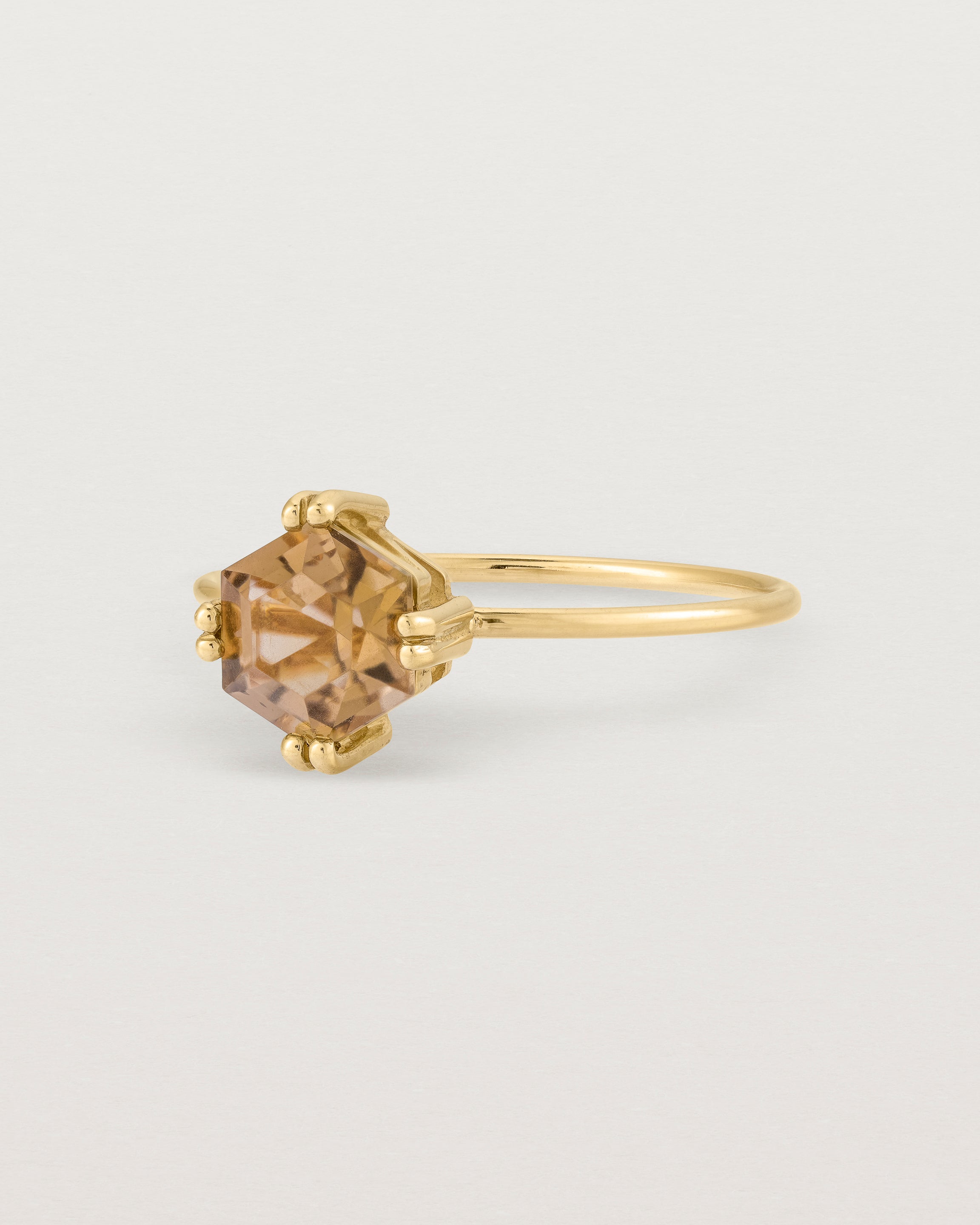 Angled view of the Hexagon Ring | Smokey Quartz in Yellow Gold.