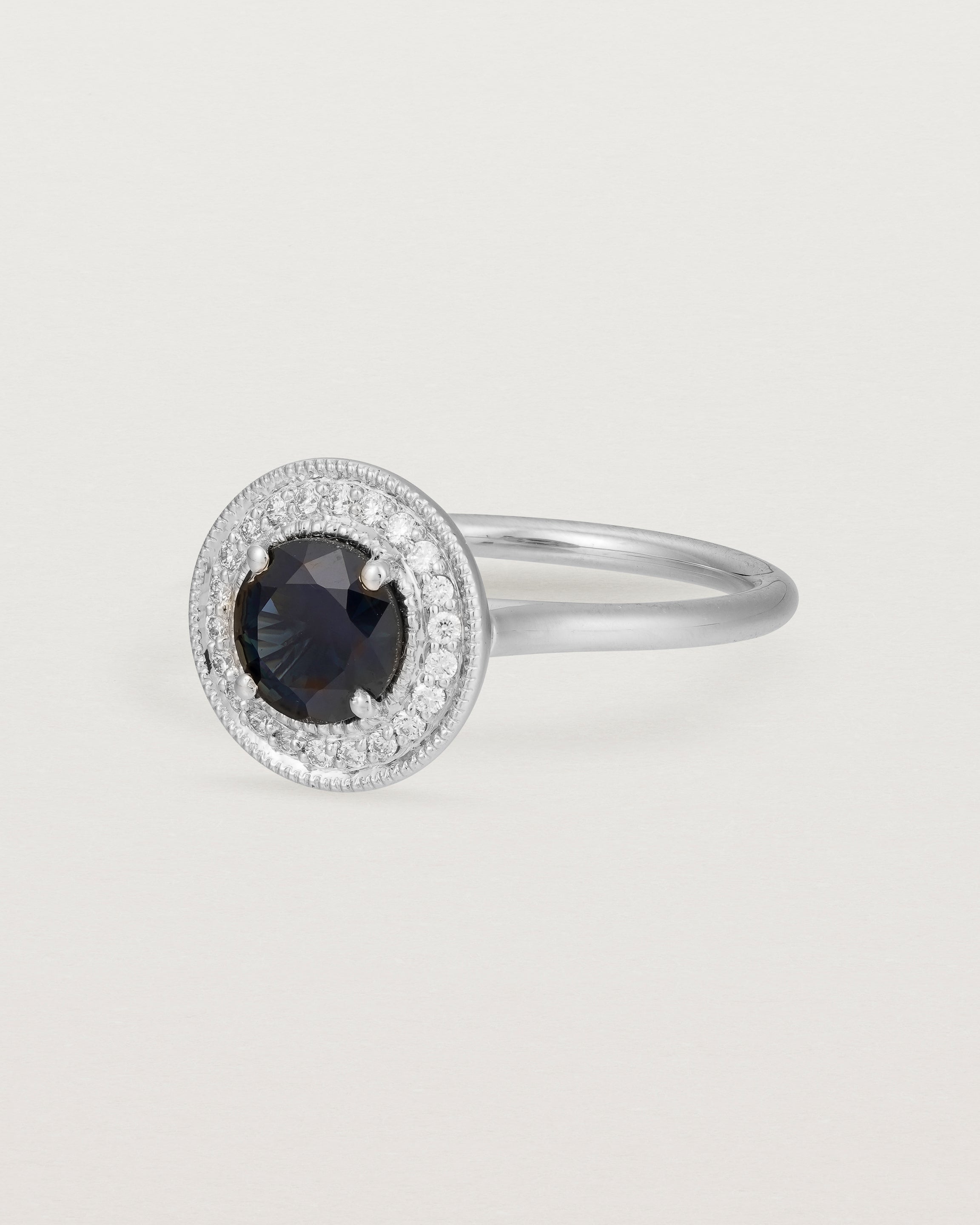 Angled view of Imogen Halo Ring | Australian Sapphire & Diamonds in White Gold.