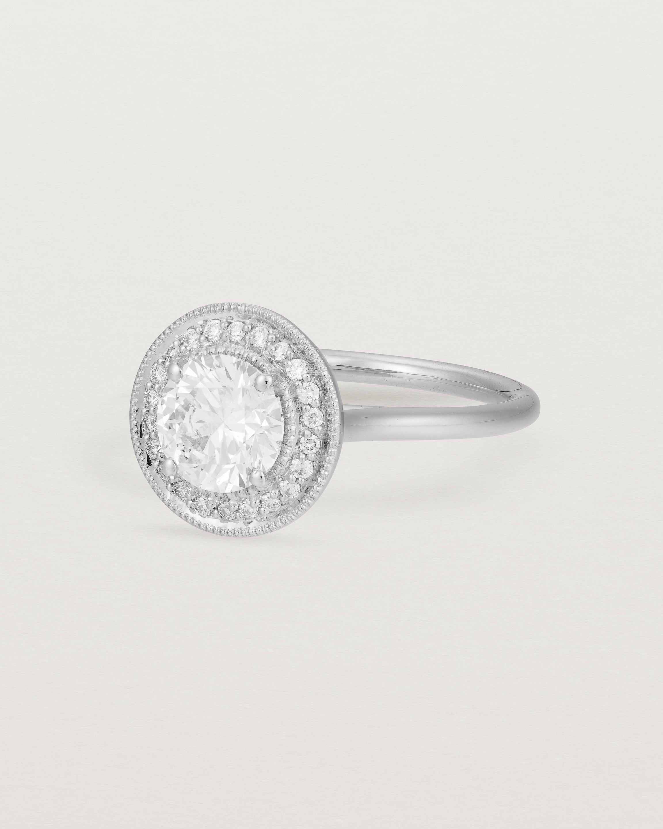 Angled view of the Imogen Halo Ring | Laboratory Grown Diamonds in White Gold.