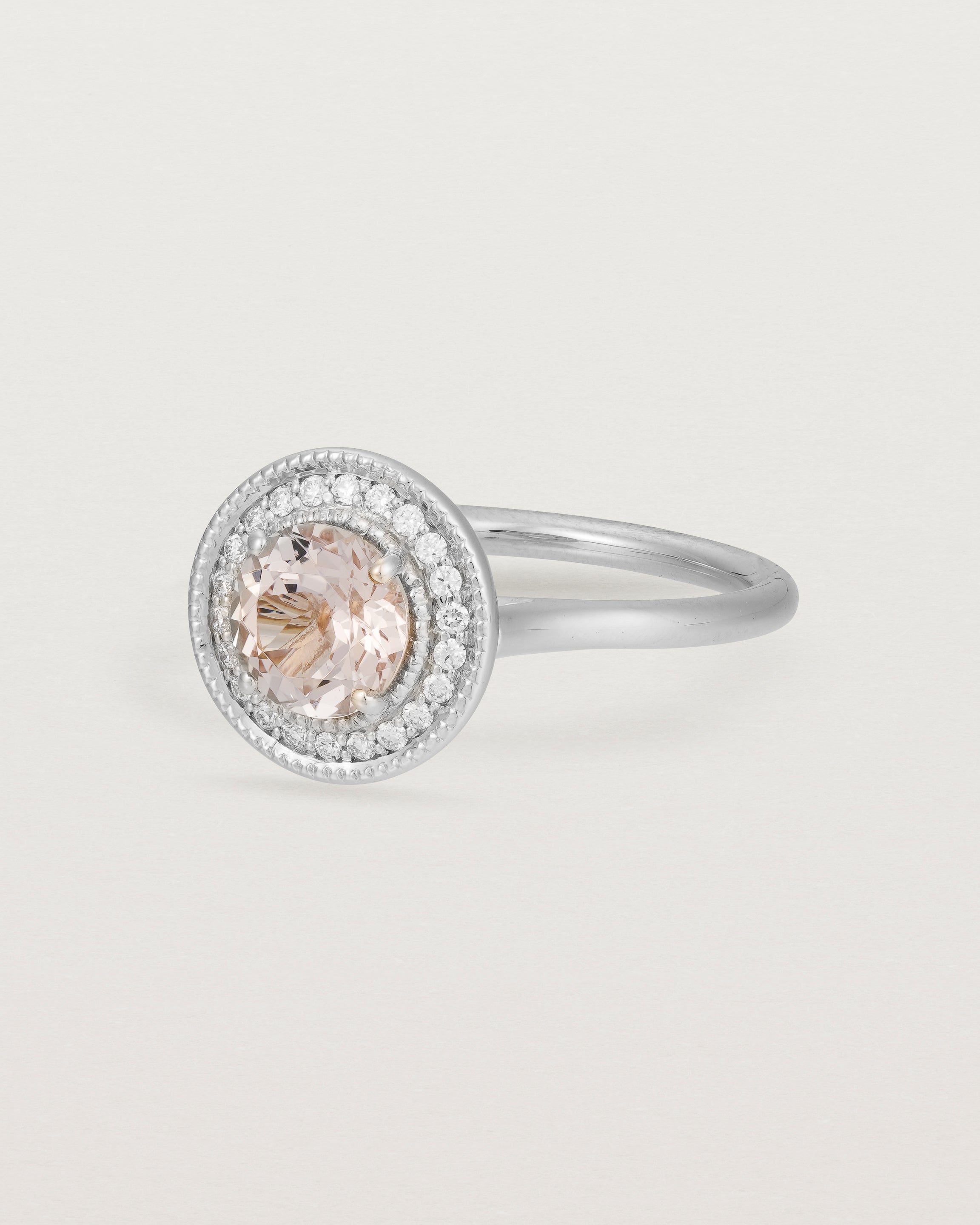 Angled view of the Imogen Halo Ring | Morganite & Diamonds in White Gold.
