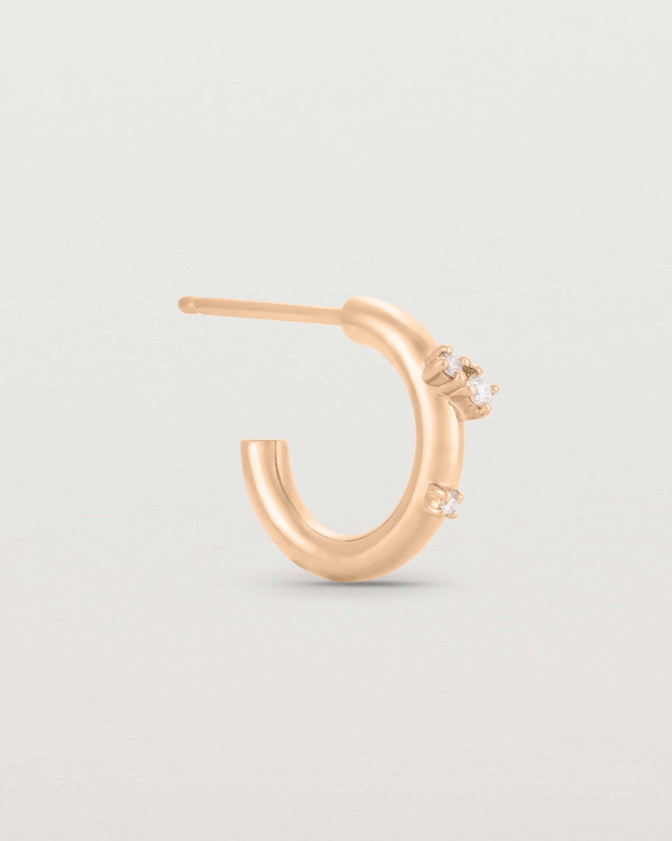 Side view of the Inés Hoops | Diamonds | Rose Gold.