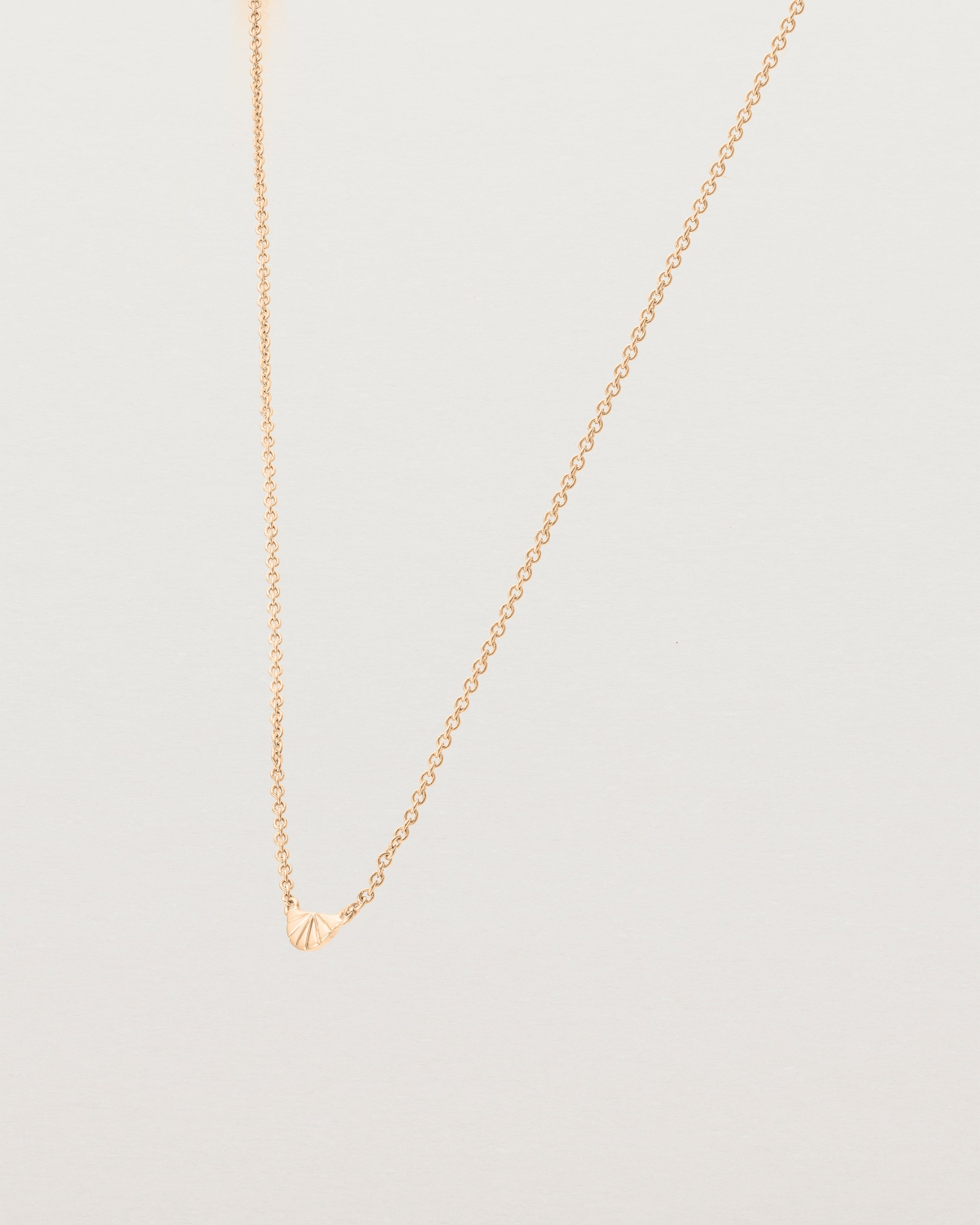 Angled view of the Jia Necklace in Rose Gold.