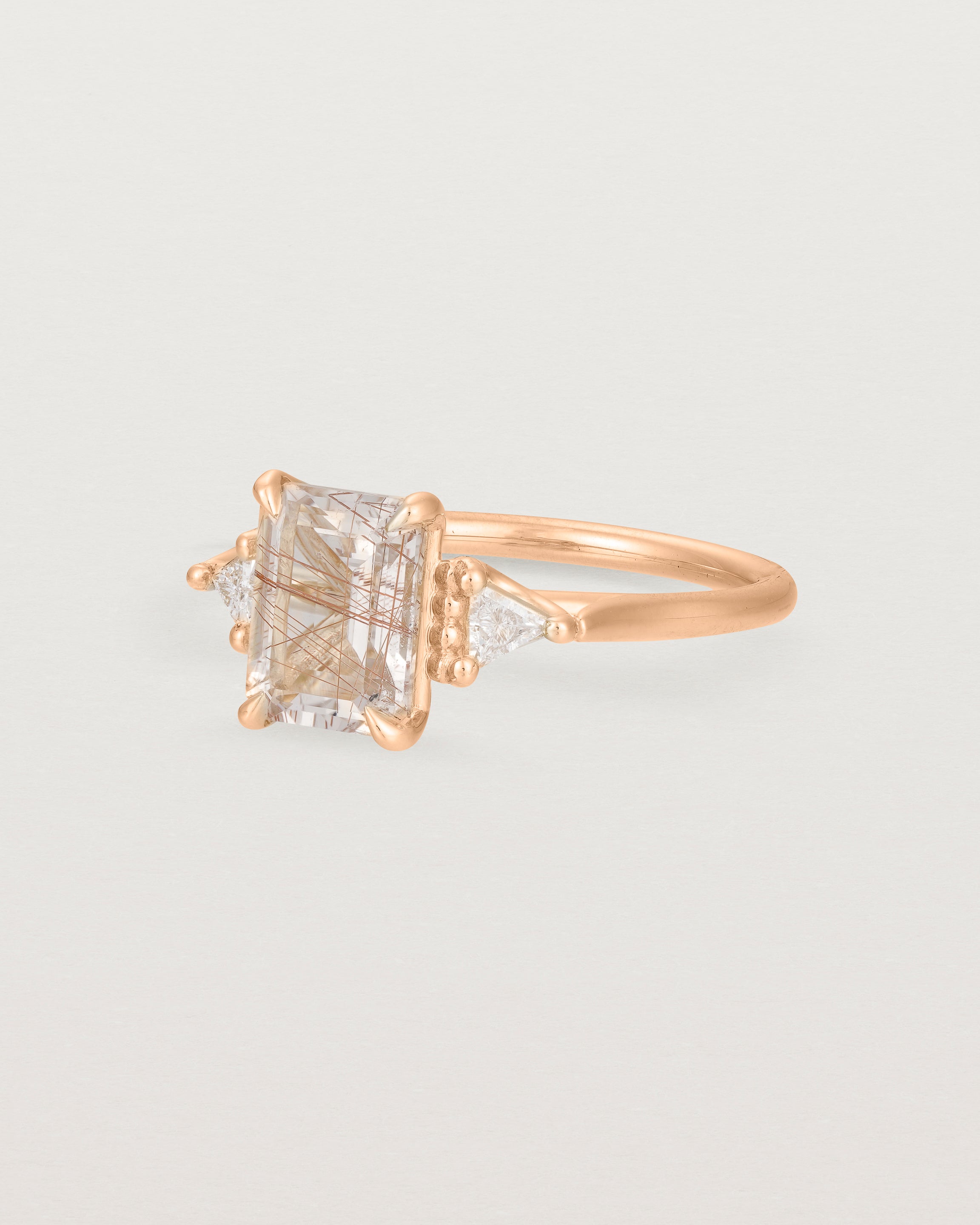 Angled view of the Lille Ring | Rutilated Quartz & Diamonds | Rose Gold. 
