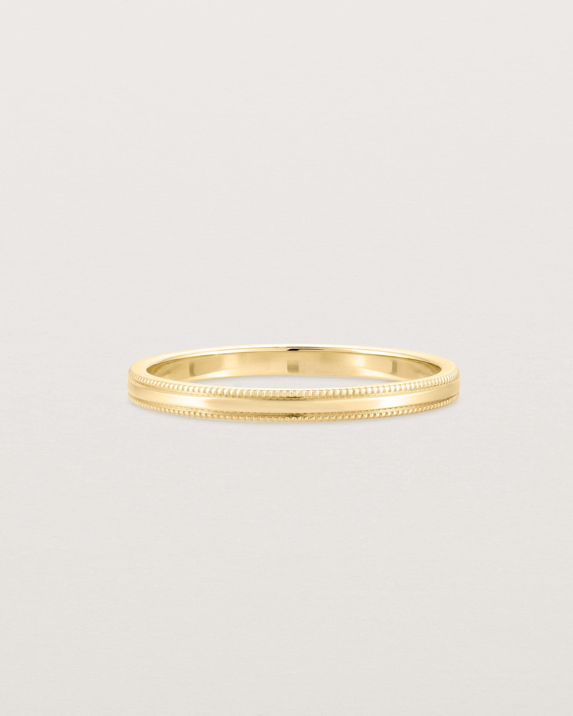 Front view of the Millgrain Wedding Ring | 2mm in Yellow Gold.