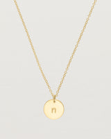 Close up of the Mini Initial Necklace in Yellow Gold.