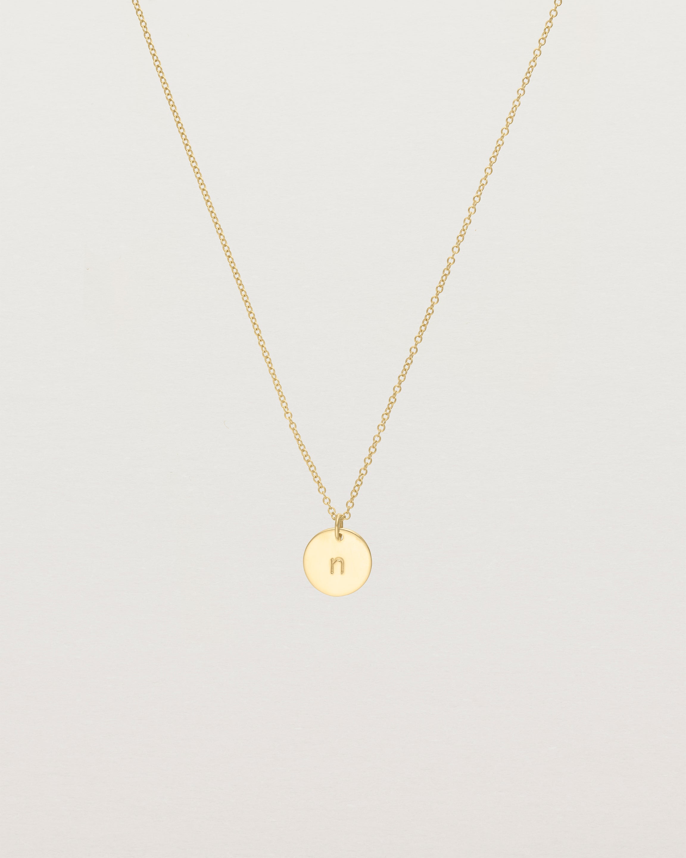 Front view of the Mini Initial Necklace in Yellow Gold.