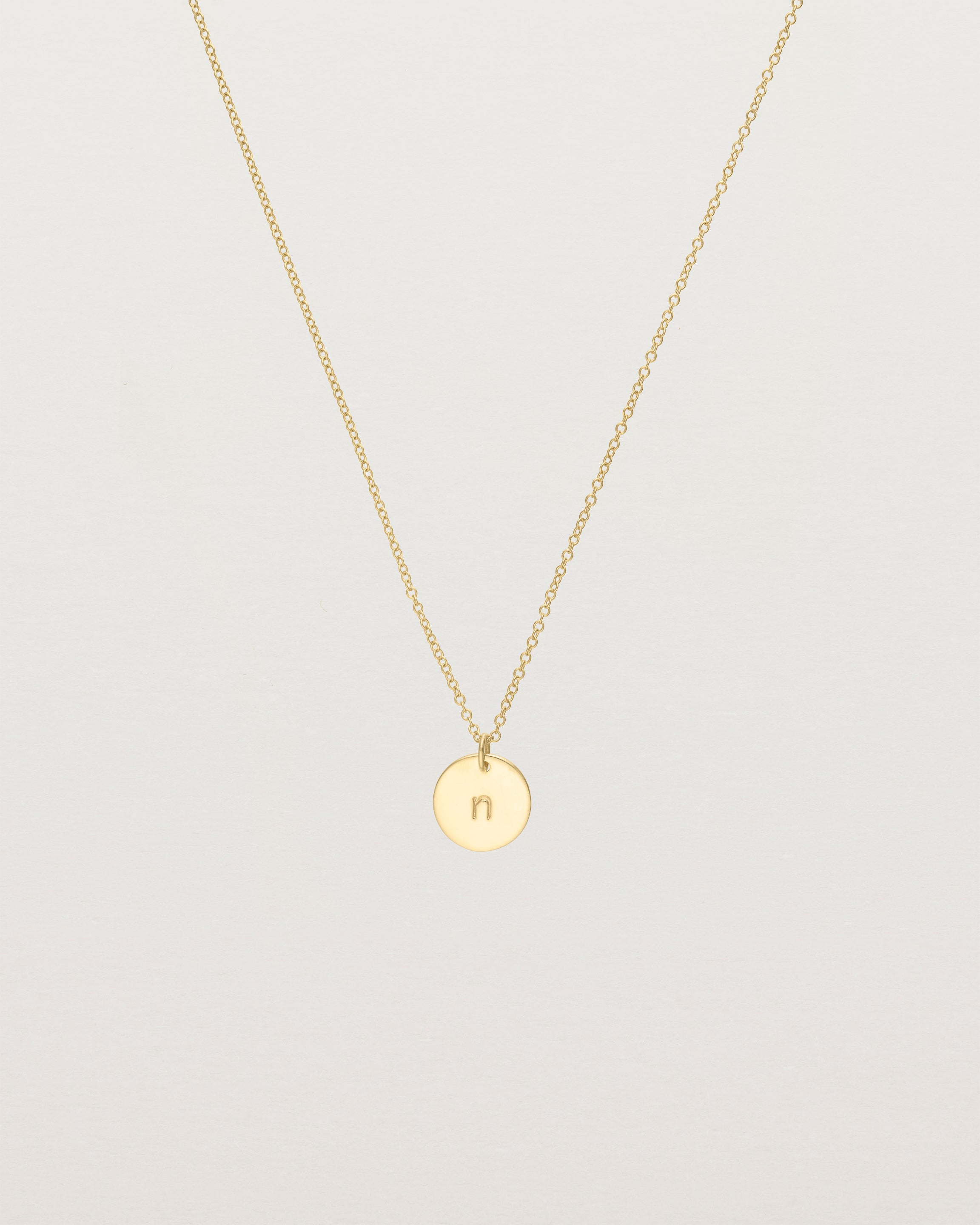 Front view of the Mini Initial Necklace in Yellow Gold.