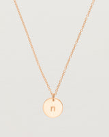 Close up of the Mini Initial Necklace in Rose Gold.