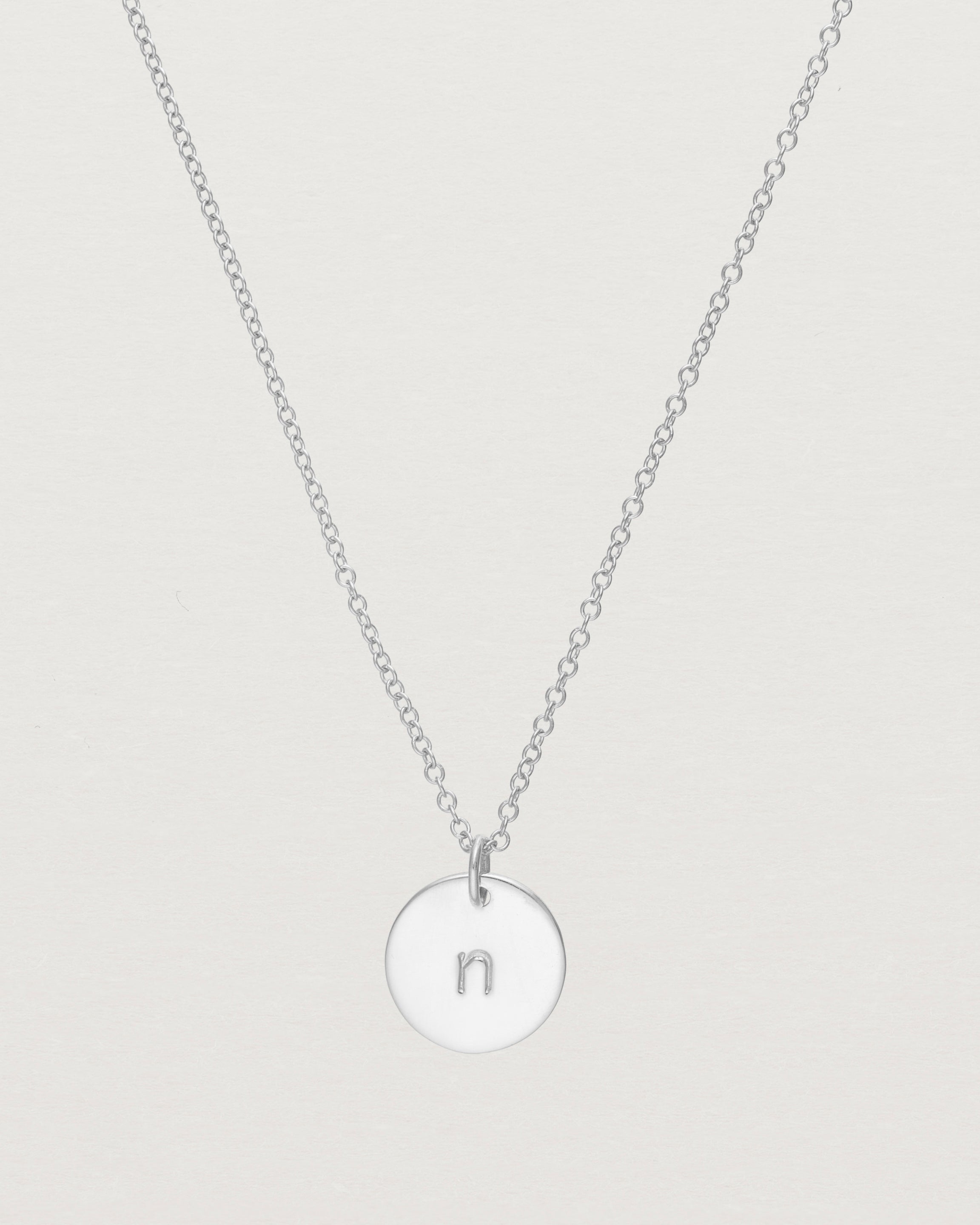 Close up of the Mini Initial Necklace in Sterling Silver.
