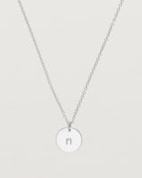 Close up of the Mini Initial Necklace in Sterling Silver.