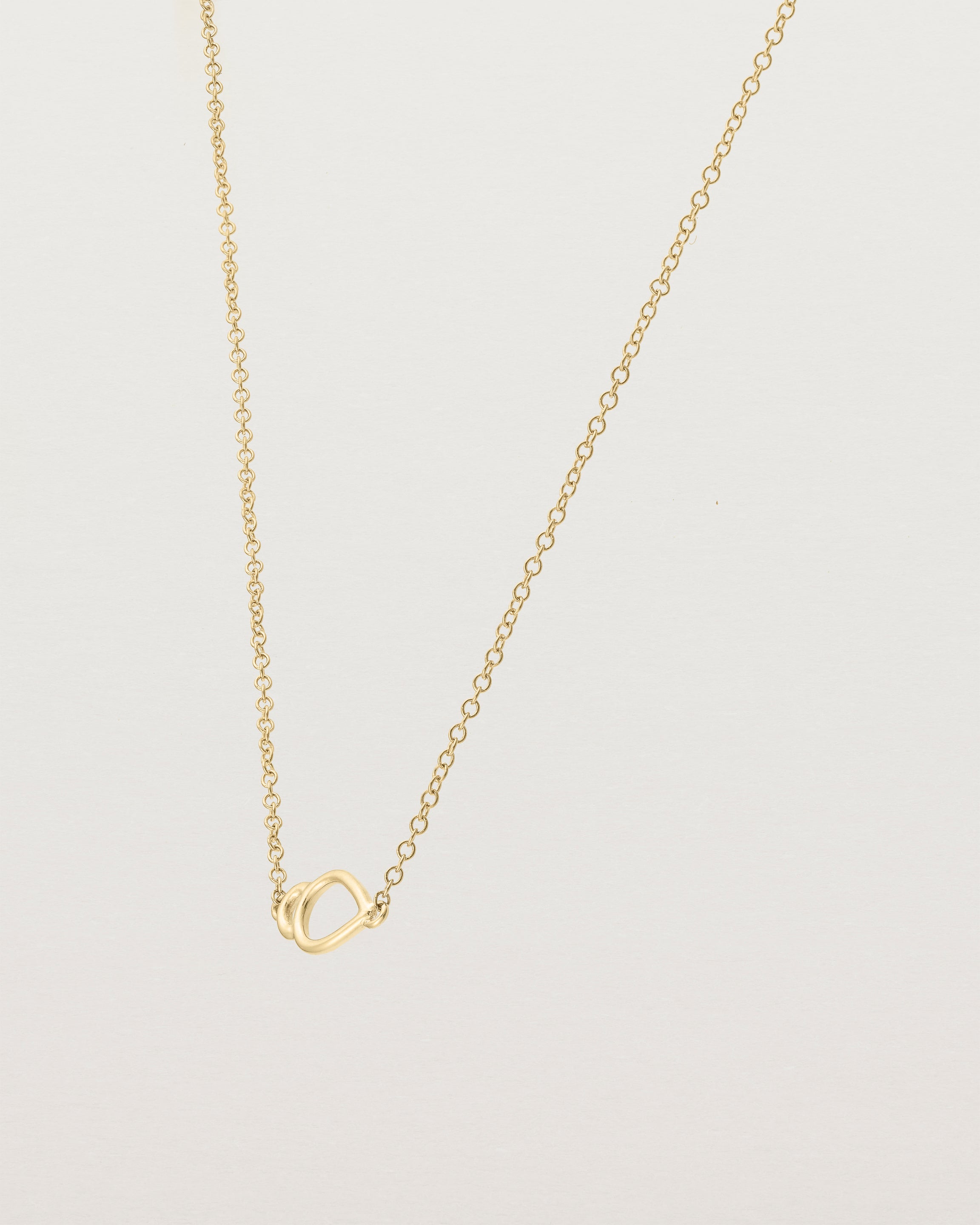 Angled view of  the Oana Necklace in Yellow Gold.