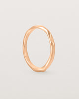 The Organic Wedding Ring | 2mm in Rose Gold standing.