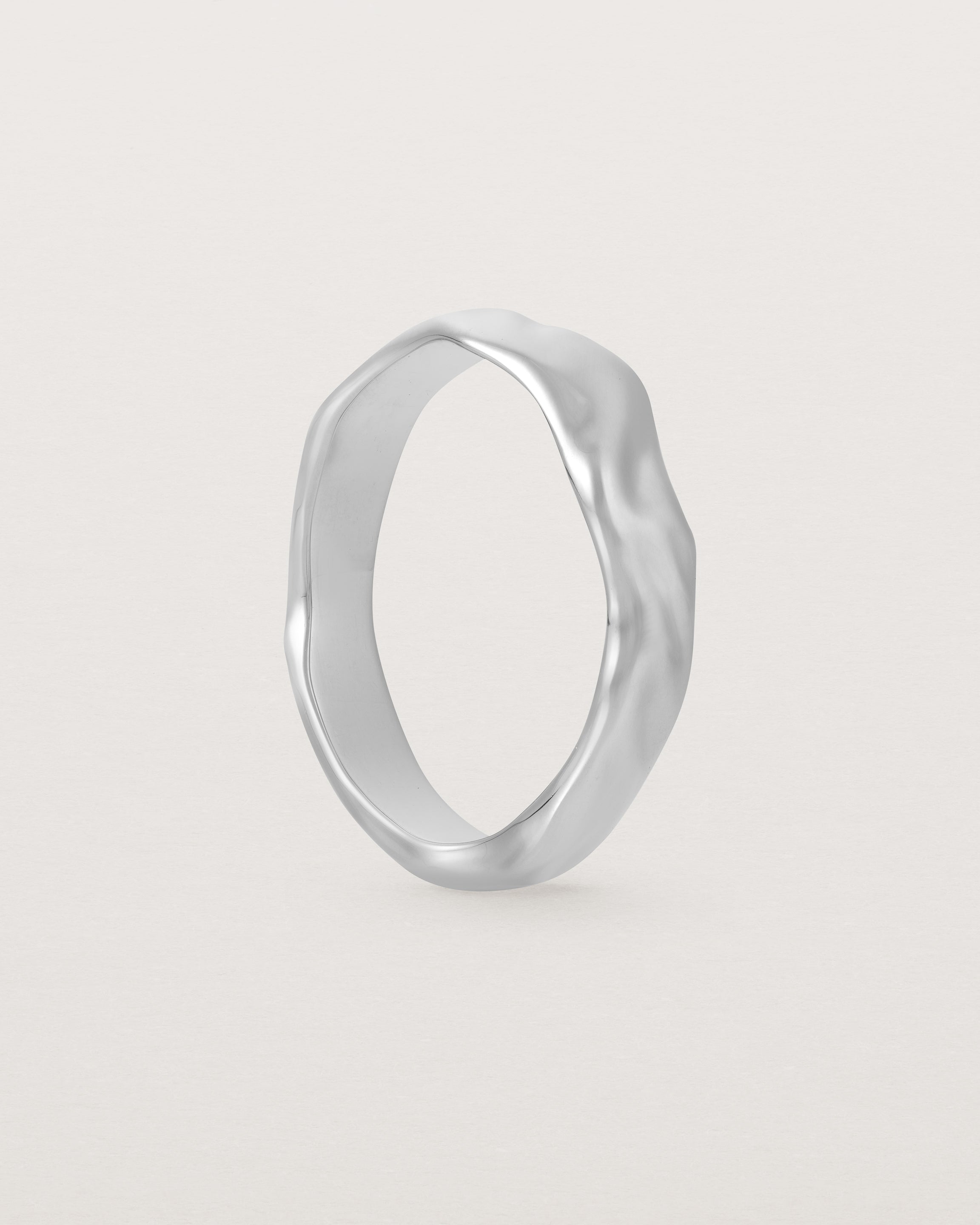 The Organic Wedding Ring | 4mm | White Gold standing. 