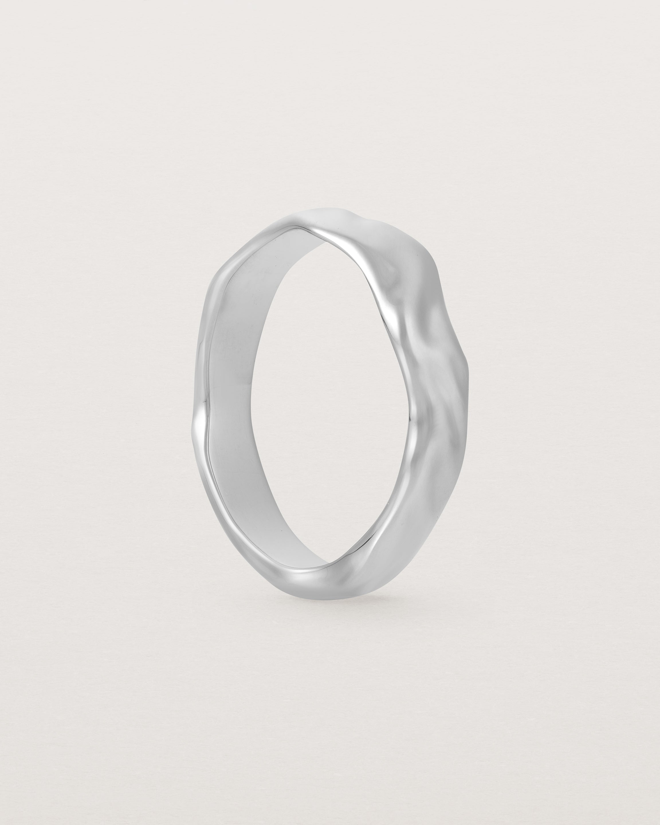 The Organic Wedding Ring | 4mm | White Gold standing. 