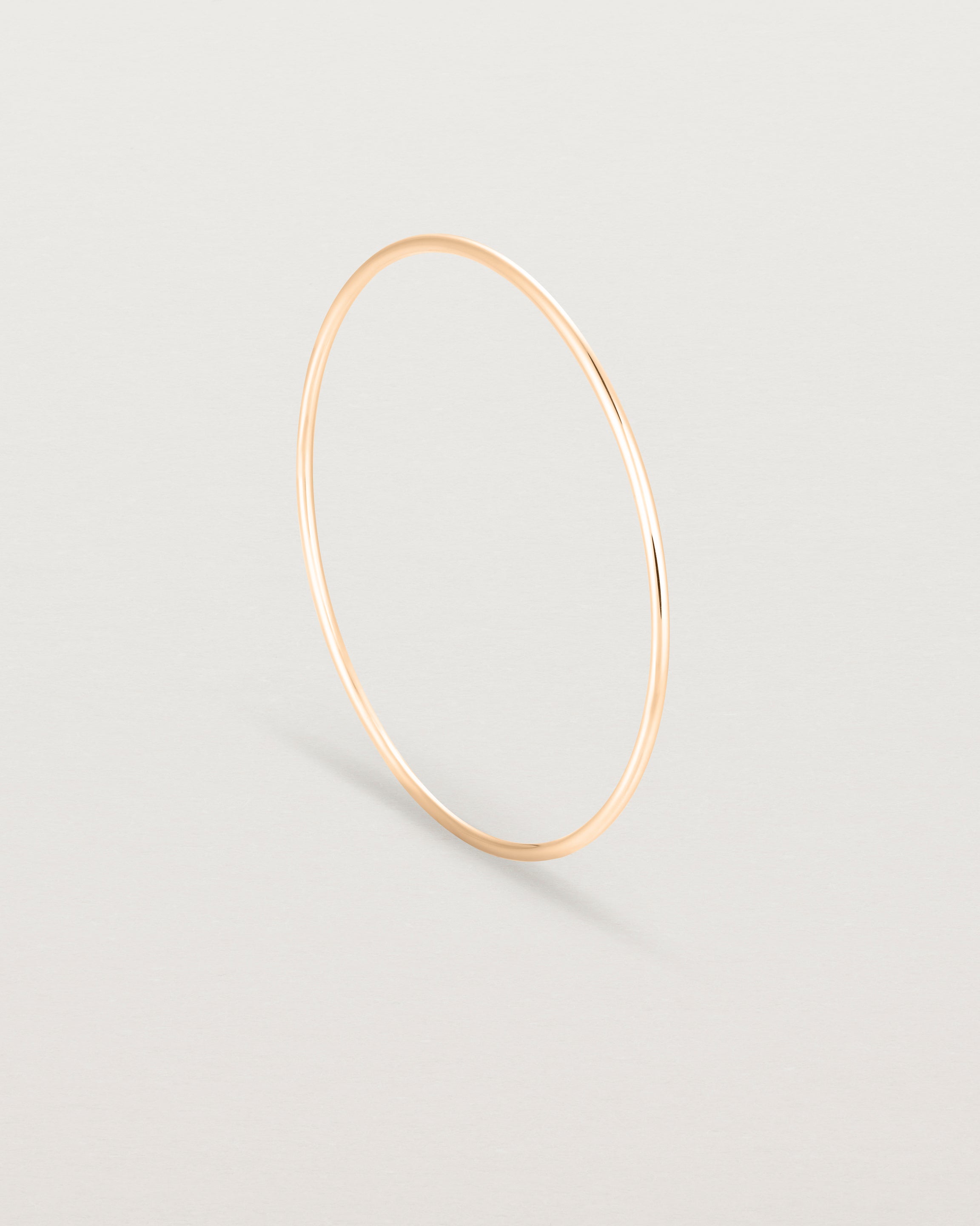 Standing view of the Oval Bangle in Rose Gold.