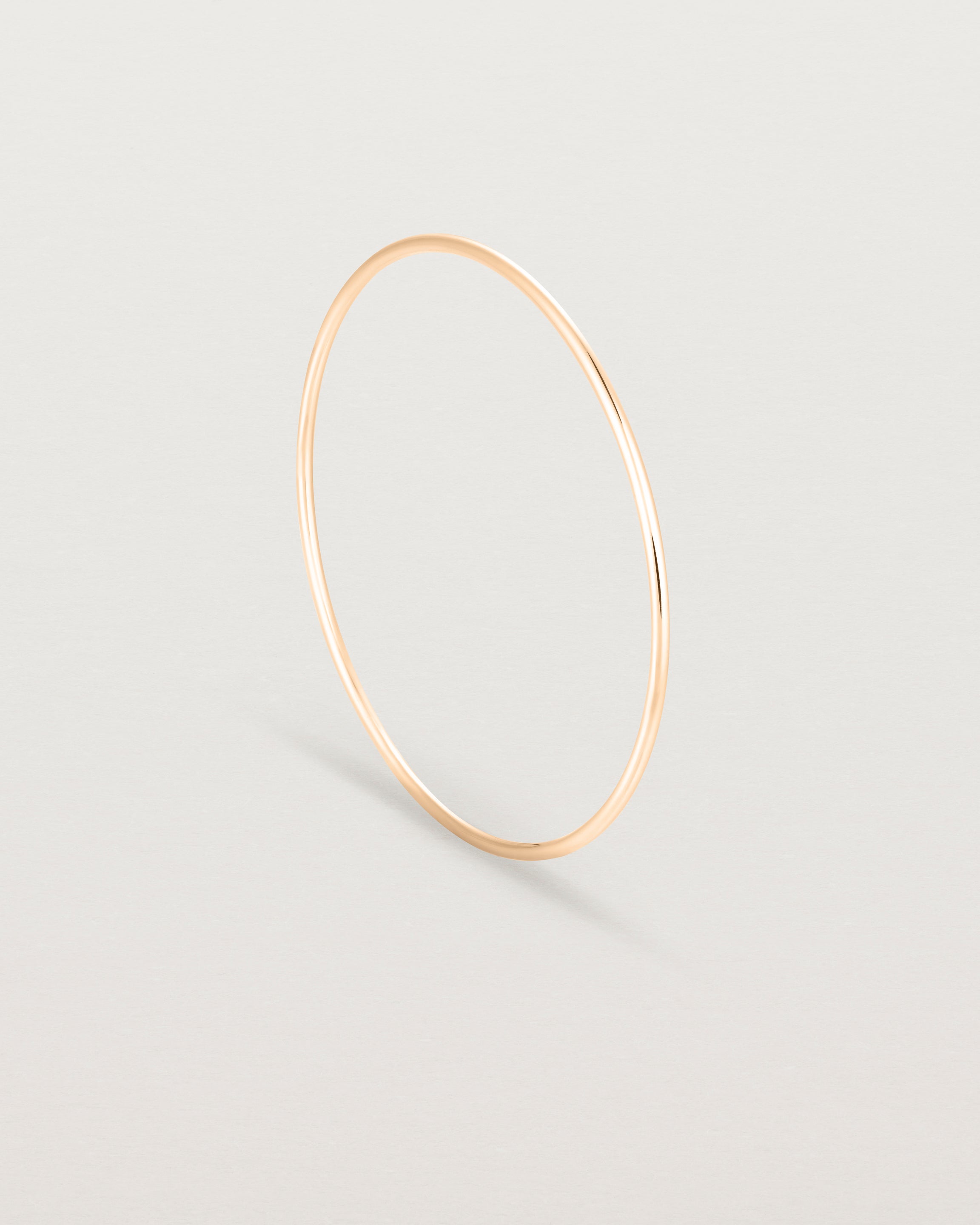 Standing view of the Oval Bangle in Rose Gold.