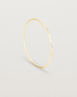 Standing view of the Oval Bangle in Yellow Gold.