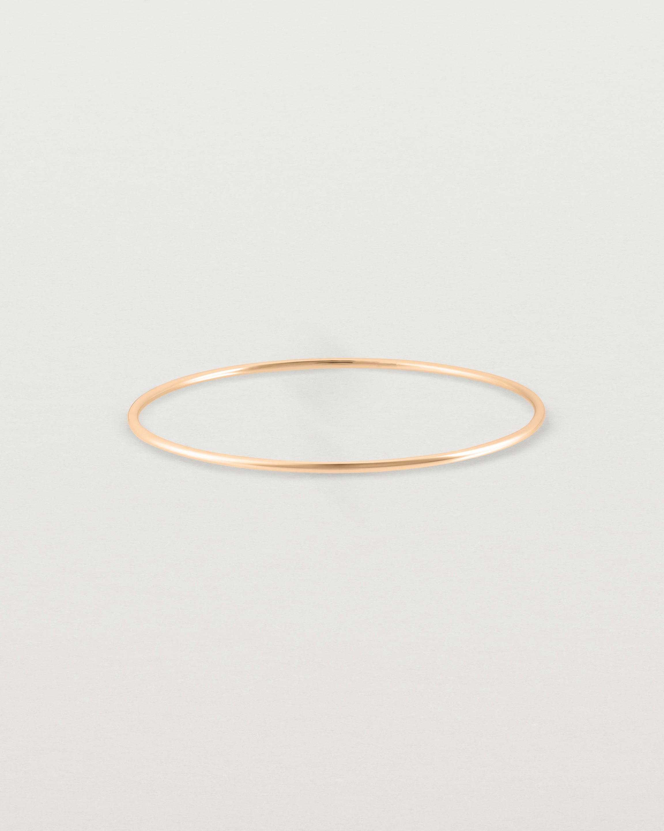 Front view of the Oval Bangle in Rose Gold.