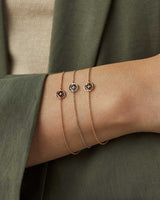 A woman wearing the Polaris Bracelet in Rose Gold, White Gold and Yellow Gold.
